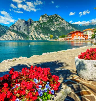 The Most Beautiful Small Towns and Villages in Europe Red flowers and promenade,Lake Garda,Northern Italy,Europe