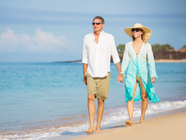 Cheapest English-Speaking Places to Retire Happy senior couple on the beach. Retirement Luxury Tropical Res
