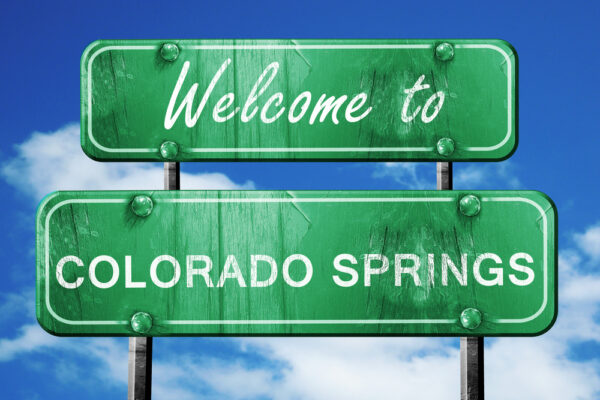 25 Best Things to Do in Colorado Springs (Local’s Guide) colorado springs vintage green road sign with blue sky backgroun