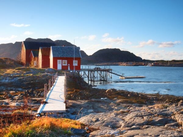 21 Best Things to do in Sweden: It's cooler than you think Traditional fishing village. Cottages at the coast on the rocky island. Red white building shinning