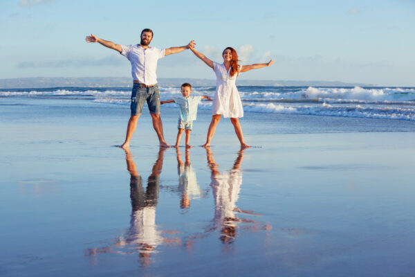 Best Cheap Family Vacations in the United States (That Are Actually Worth It) Bali/ family on beach